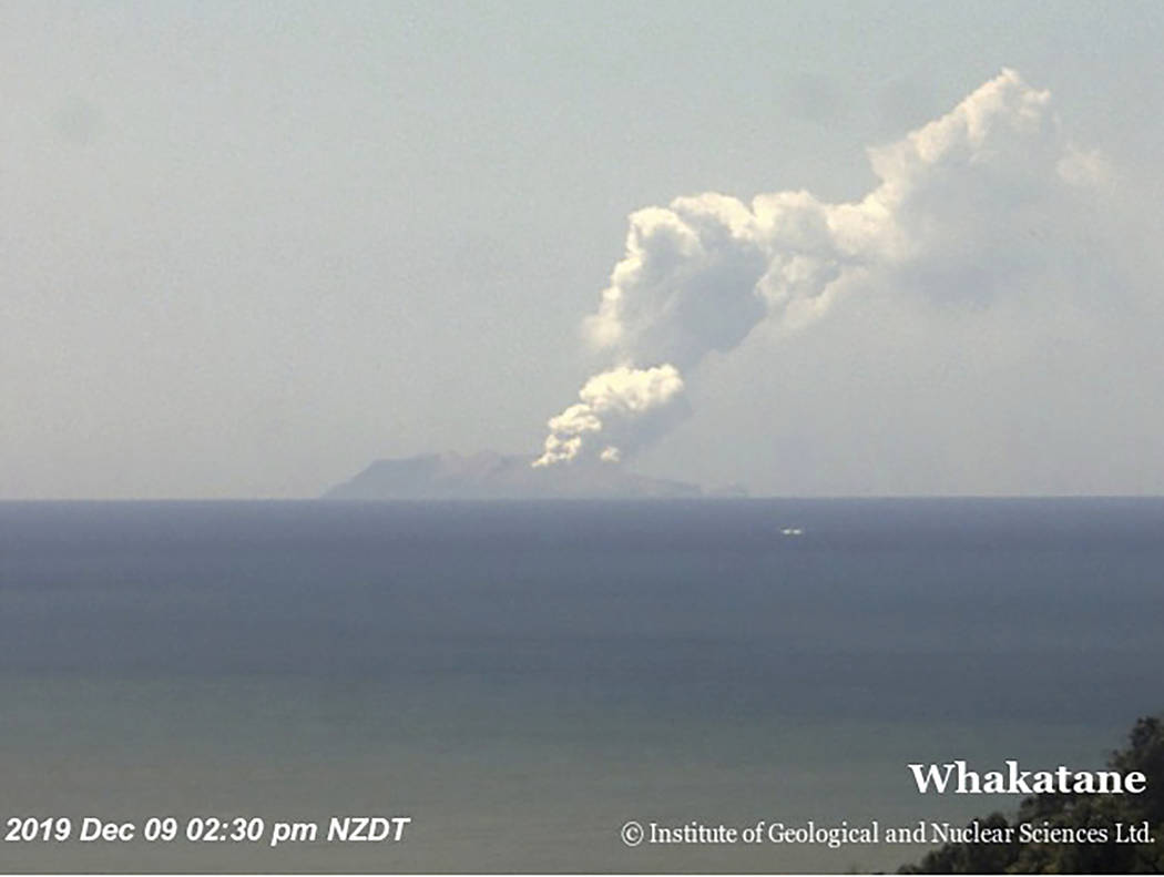 This image released by GNS Science, shows plumes of smoke from a volcanic eruption on White Isl ...