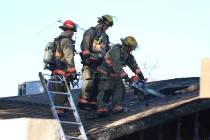 Clark County firefighters battle a house fire at 4860 Plata del Sol Drive on Monday, Dec. 9, 20 ...