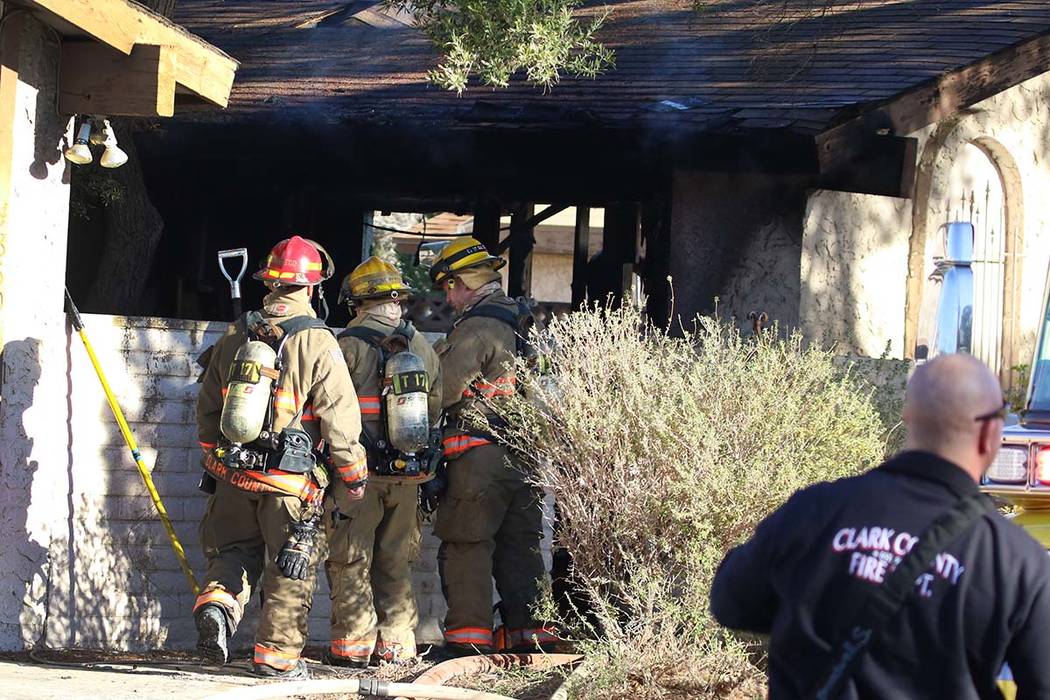 Clark County firefighters battle a house fire at 4860 Plata del Sol Drive on Monday, Dec. 9, 20 ...