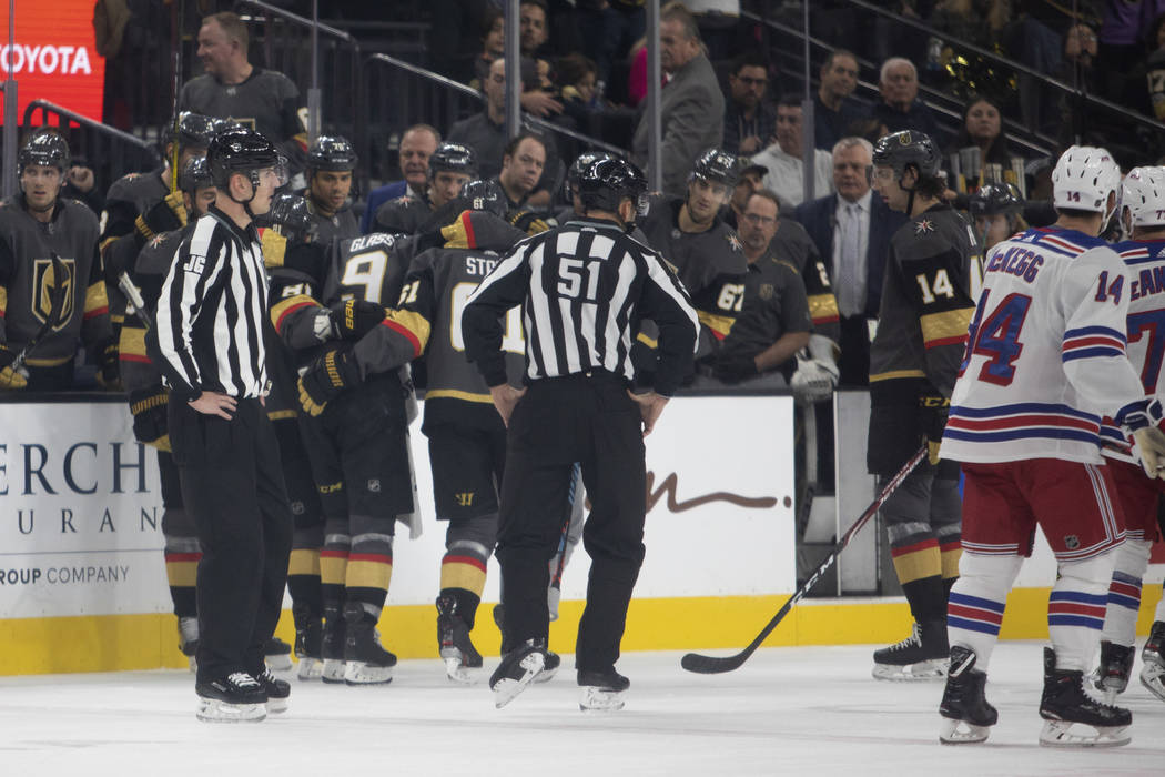 Golden Knights center Cody Glass (9) is carried off the ice by teammates Mark Stone (61) and Jo ...
