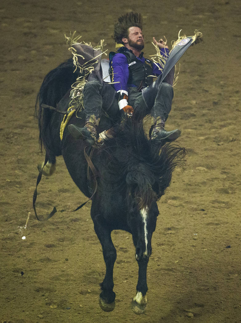 Jake Brown of Cleveland, Texas, rides Ruby's Girl during Bareback Riding in the fourth go round ...
