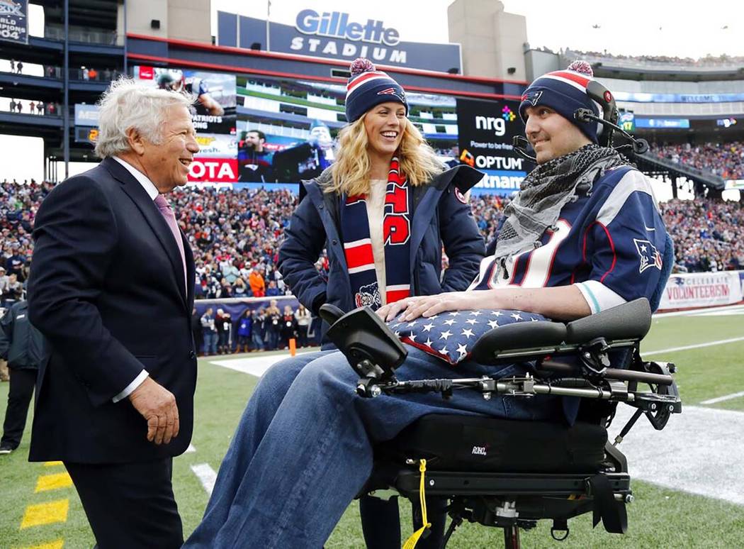 FILE - In this Dec. 28, 2014, file photo, New England Patriots owner Robert Kraft, left, smiles ...