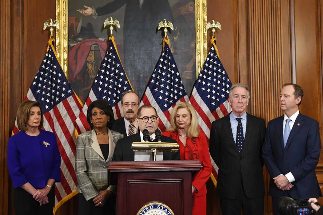 Members of the U.S. House of Representatives unveil articles of impeachment against President D ...