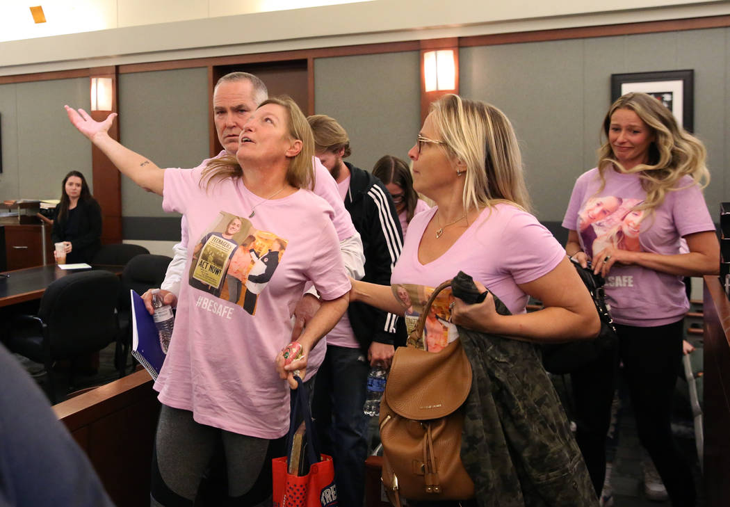 Jamie Minkler, left, mother of murder victim Matthew Minkler, 17, reacts as her husband, Steven ...