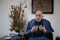 Former Afghan President Hamid Karzai speaks during an interview with The Associated Press, in K ...