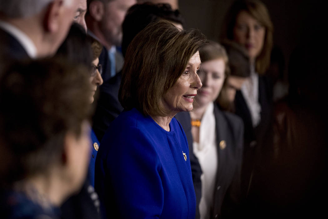 House Speaker Nancy Pelosi of Calif., accompanied by House Congress members, speaks at a news c ...