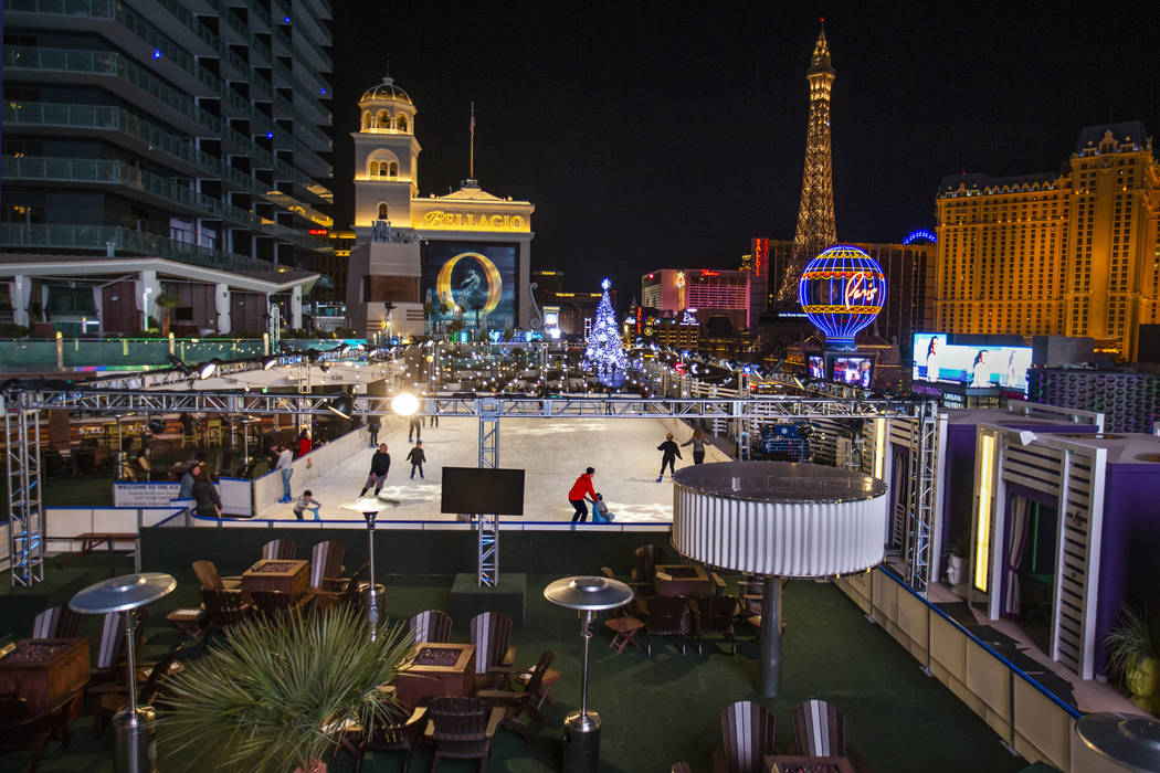 People enjoy some skating on the ice rink at The Cosmopolitan of Las Vegas on Monday, Dec. 2, 2 ...