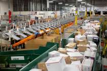 The U.S. Postal Service mail processing annex is full of packages ahead of the holidays on Thur ...