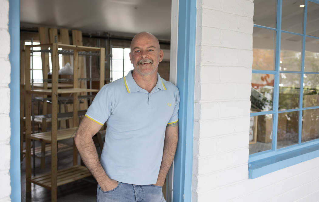 Mike Buckham of Mike's Recovery poses for a portrait in the doorway of his new shop at Ferguson ...