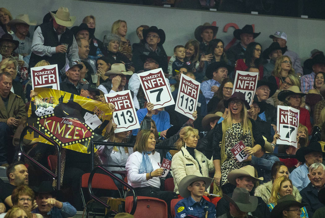 Fans cheer for their competitors at the start of the sixth go-round of the National Finals Rode ...