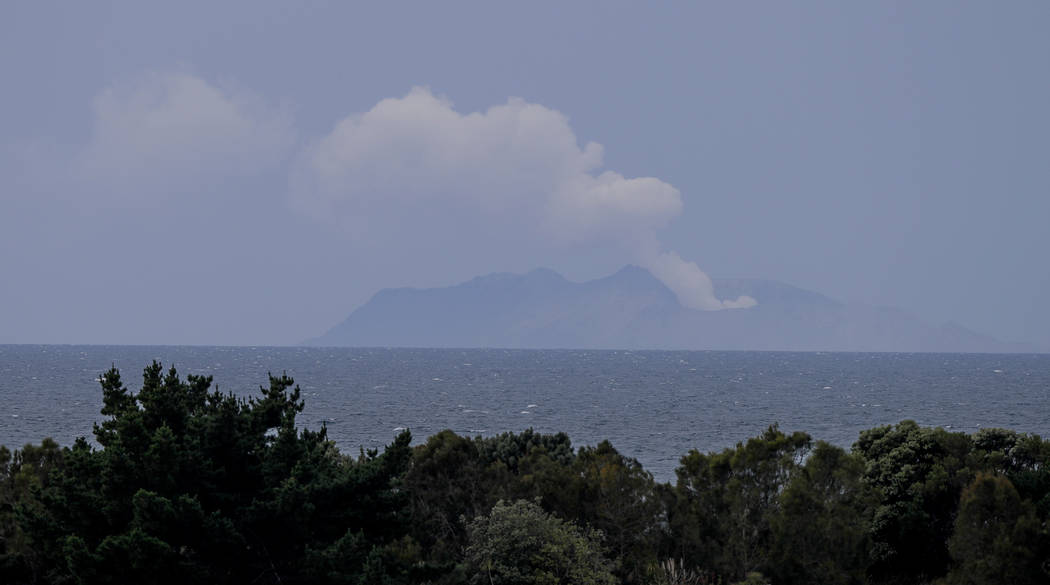 Plumes of steam rise above White Island off the coast of Whakatane, New Zealand, Wednesday, Dec ...