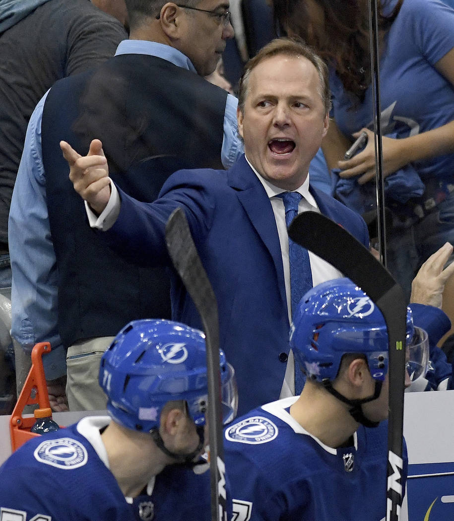 Tampa Bay Lightning coach Jon Cooper gives his team instructions during the third period of an ...