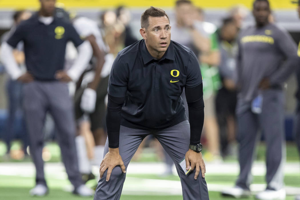 Oregon Ducks Assistant Coach Marcus Arroyo watches the AdvoCare Classic college football game b ...