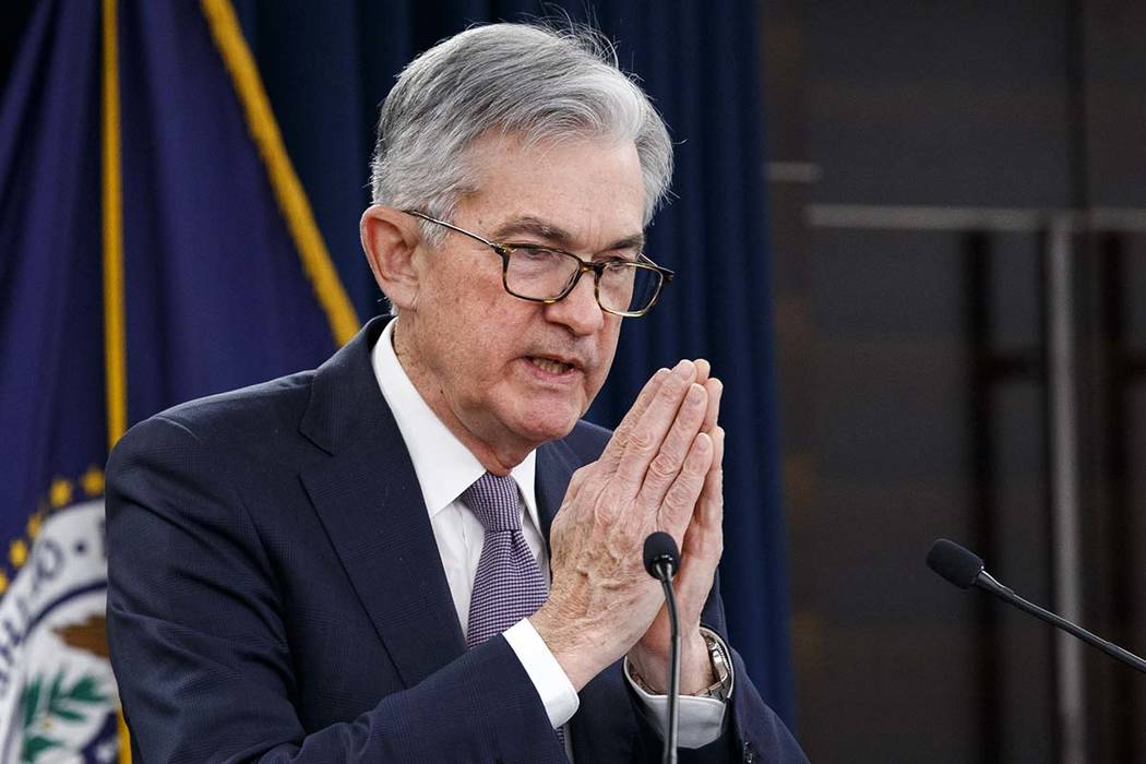 Federal Reserve Chair Jerome Powell gestures while speaking during a news conference after the ...