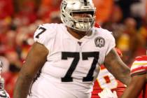 Oakland Raiders quarterback Derek Carr (4) throws the football as offensive tackle Trent Brown ...