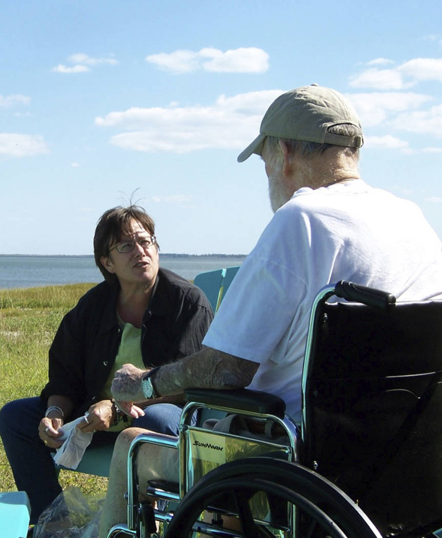 In this Sept. 29, 2009 photo provided by Betsy McNair, Betsy, left, speaks to her father Robert ...