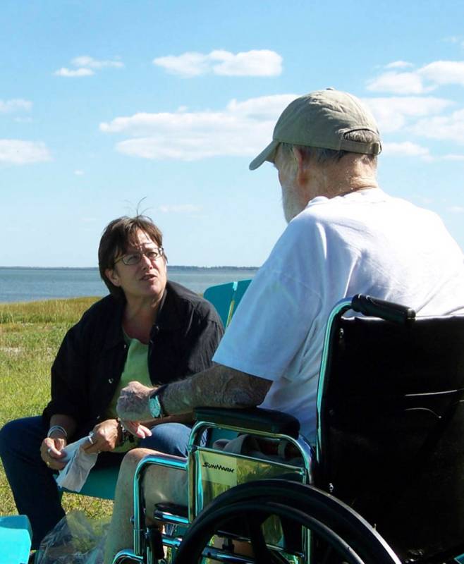 In this Sept. 29, 2009 photo provided by Betsy McNair, Betsy, left, speaks to her father Robert ...