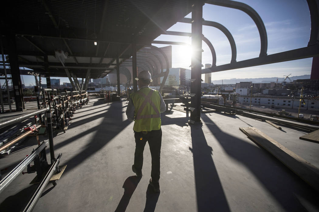 Terry Miller, owner representative with Cordell Corporation, leads a tour of the new expansion ...