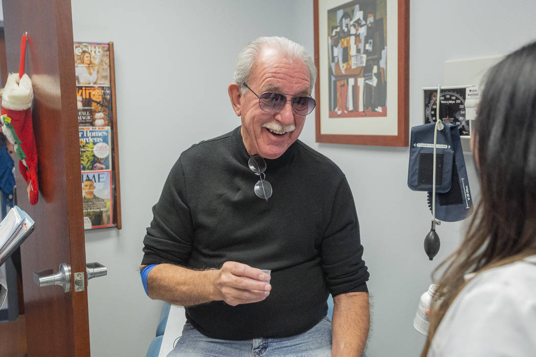 Fred Warnick, 73, holds his medication, zanubrutinib, at Comprehensive Cancer Centers in Hender ...