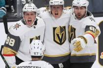 Golden Knights center Cody Eakin (21) celebrates with teammates Nate Schmidt (88), Alex Tuch (8 ...