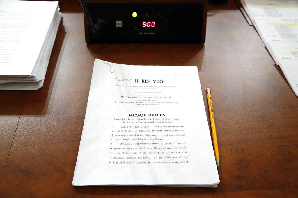 A copy of House Resolution 755 on a desk for a House Judiciary Committee markup of the articles ...