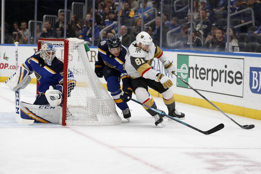 Vegas Golden Knights' Jonathan Marchessault (81) reaches for a puck as St. Louis Blues goaltend ...