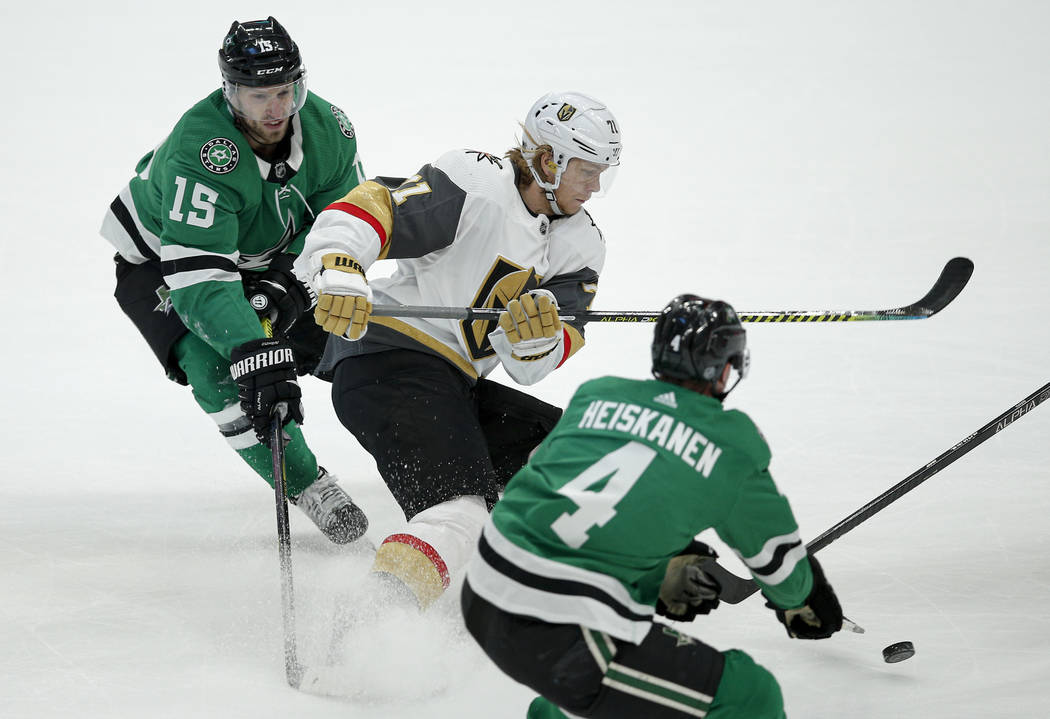 Vegas Golden Knights forward William Karlsson (71) battles Dallas Stars forward Blake Comeau (1 ...