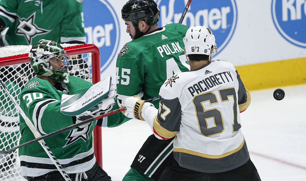 Vegas Golden Knights forward Max Pacioretty (67) battles Dallas Stars goaltender Ben Bishop (30 ...