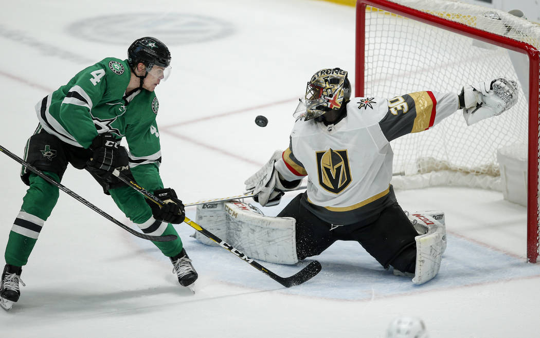 Vegas Golden Knights goaltender Malcolm Subban (30) deflects a shot from Dallas Stars defensema ...