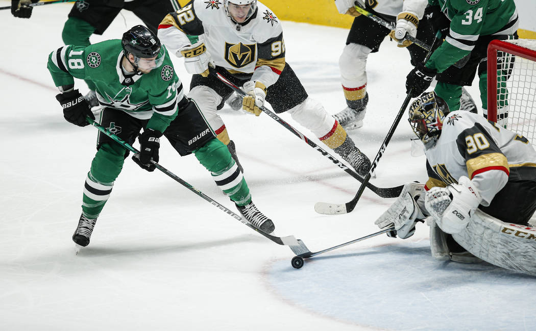 Dallas Stars forward Jason Dickinson (18) attempts a shot as Vegas Golden Knights goaltender Ma ...