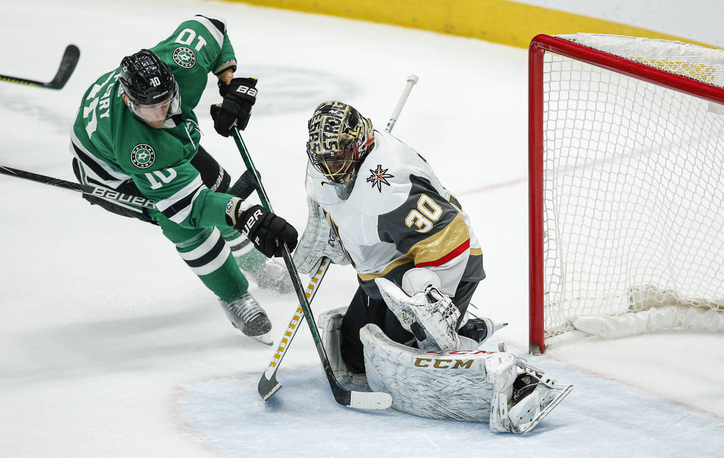 Dallas Stars forward Corey Perry (10) attempts a shot as Vegas Golden Knights goaltender Malcol ...