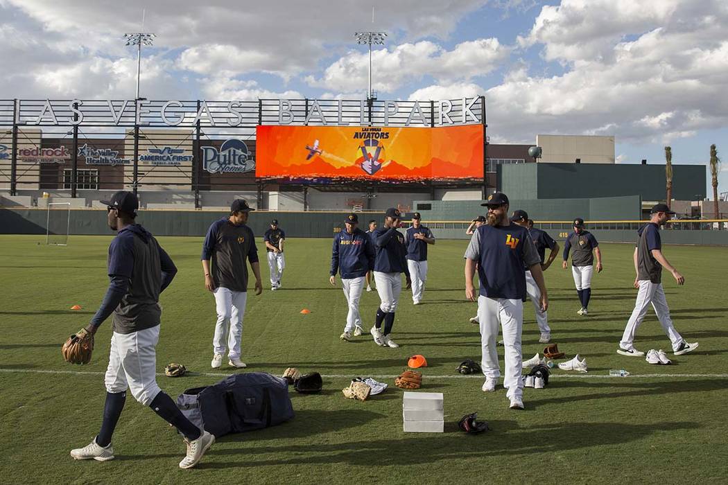Aviators players warm up before the start of practice during media day at Las Vegas Ballpark, A ...