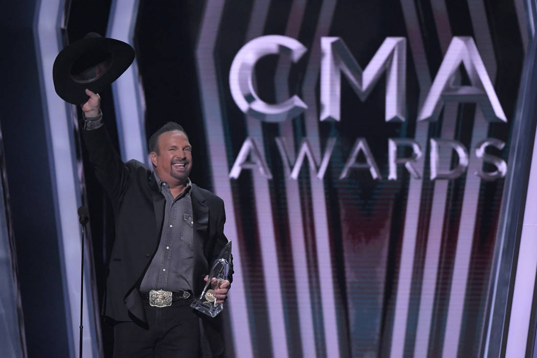 Garth Brooks accepts the award for entertainer of the year at the 53rd annual CMA Awards at Bri ...