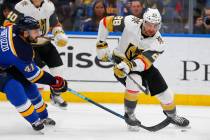 Vegas Golden Knights' William Carrier (28) loses control of the puck against St. Louis Blues' R ...
