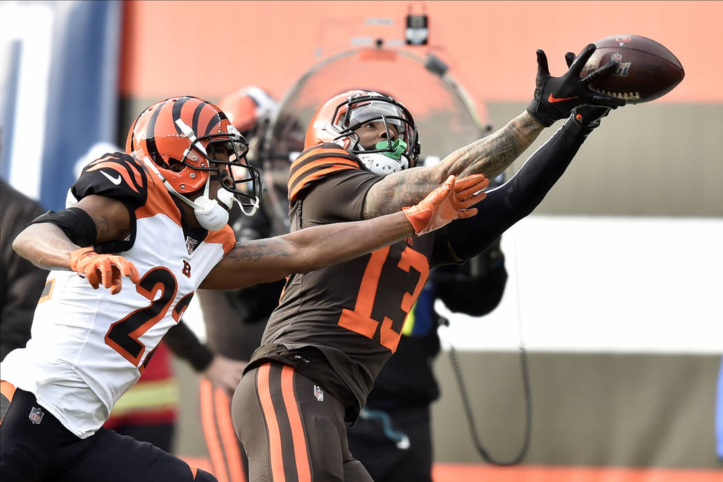 Cleveland Browns wide receiver Odell Beckham Jr. (13) makes a catch beside Cincinnati Bengals c ...