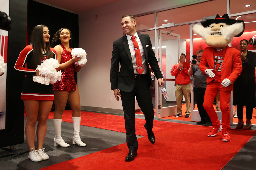 New UNLV football head coach Marcus Arroyo is introduced during a press conference at UNLV's Fe ...