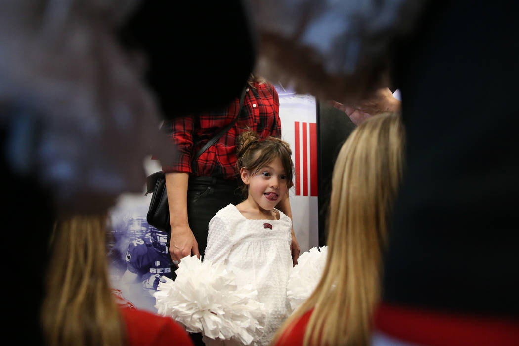 Cruz Arroyo, 6, the daughter of UNLV's new football coach Marcus Arroyo, attends a press confer ...