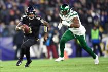 Baltimore Ravens quarterback Lamar Jackson (8) runs with the ball as New York Jets outside line ...