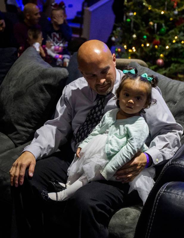 Chris Ritenour holds his daughter, Rayleigh Ritenour, 1, for the second time in her life at HOP ...