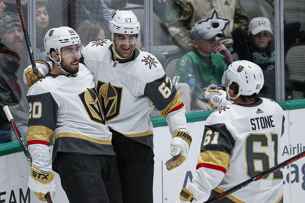 Vegas Golden Knights forward Chandler Stephenson (20) is congratulated by teammates after scori ...