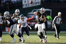 Oakland Raiders quarterback Derek Carr (4) passes against the Tennessee Titans during the first ...