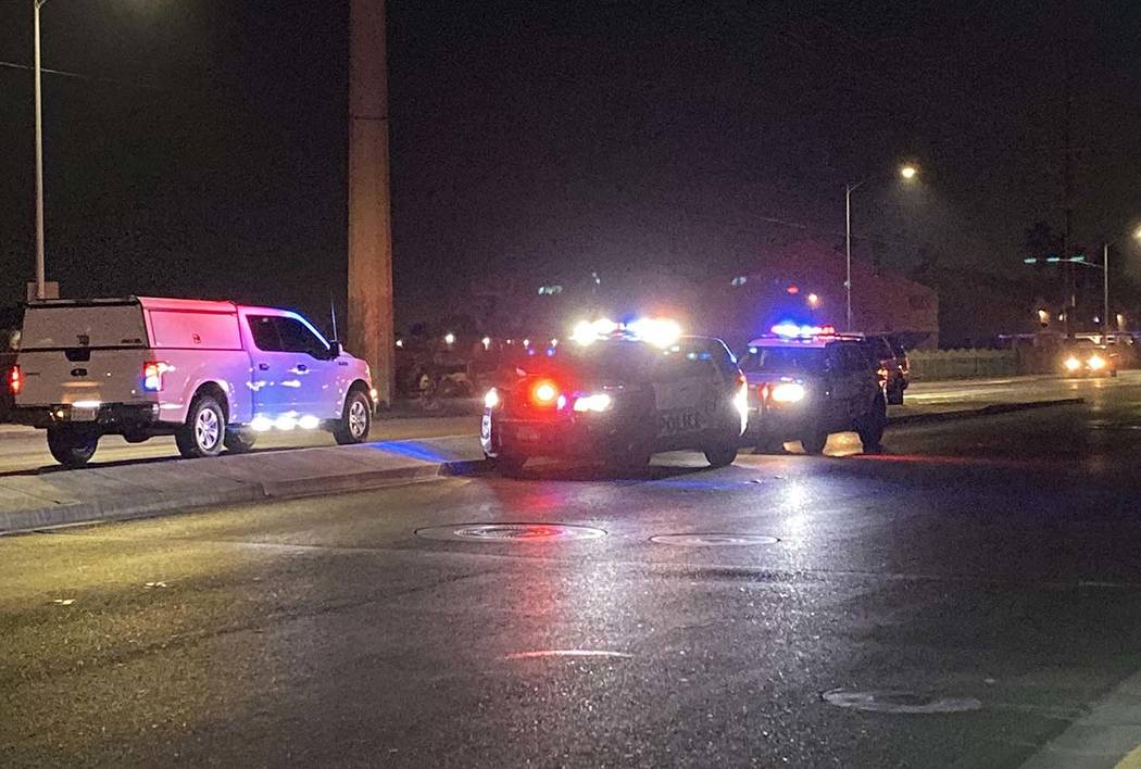 Police units block traffic near East Lake Mead Boulevard and North Pecos Road after a two-vehic ...