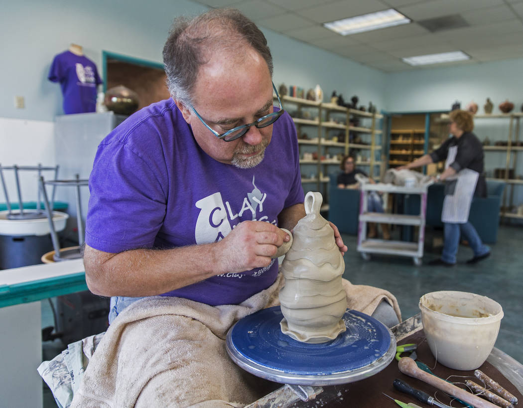 Thomas Bumblauskas, co-owner of Clay Arts Vegas, works on the wheel at the newly opened studio ...