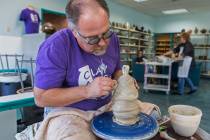 Thomas Bumblauskas, co-owner of Clay Arts Vegas, works on the wheel at the newly opened studio ...