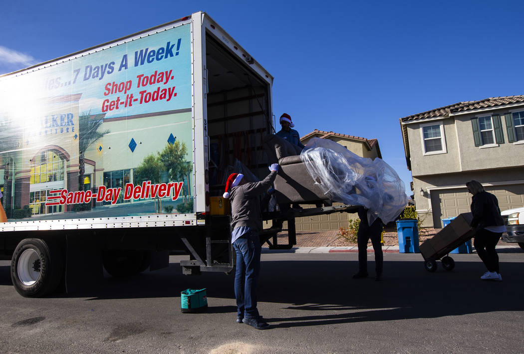 Employees from Walker Furniture deliver a truckload of furnishings for Lucille McKnight and her ...