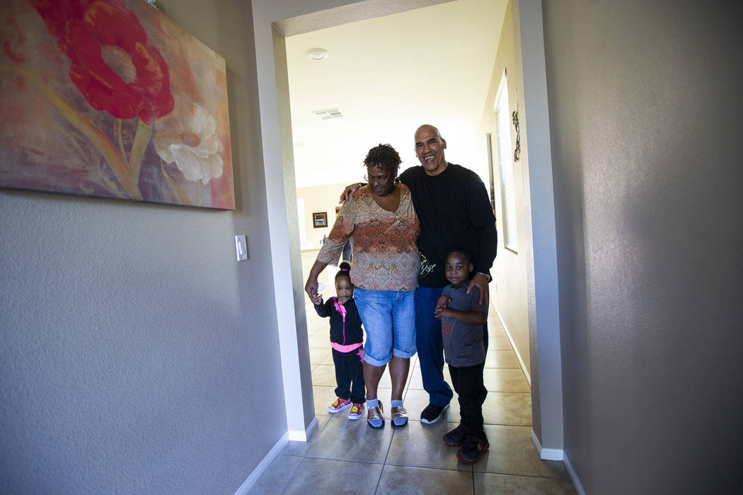 Lucille McKnight, second from left, stands with her great-niece and nephew, Christine Modica, 2 ...