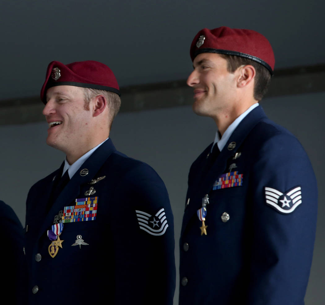 Recipient of the Purple Heart and Silver Star Medal Technical Sgt. Gavin Fisher, left, and reci ...