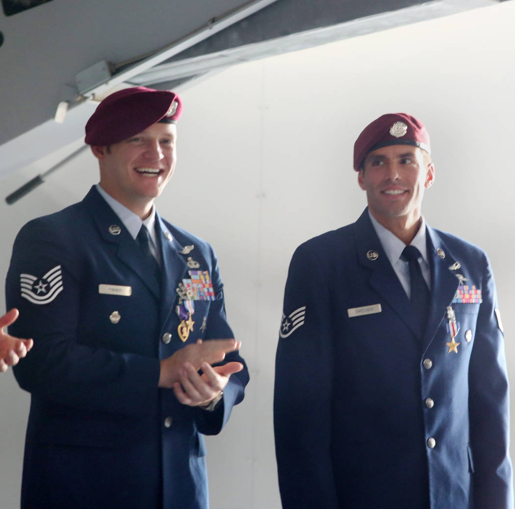 Recipient of the Purple Heart and Silver Star Medal Technical Sgt. Gavin Fisher, left, and reci ...
