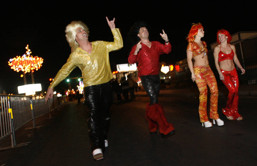 Revelers strut along the Strip on Dec. 31, 2005. (Isaac Brekken/Las Vegas Review-Journal)