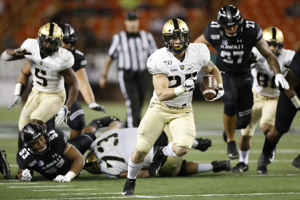 Army running back Connor Slomka (25) cuts through the Hawaii defense for a touchdown during the ...